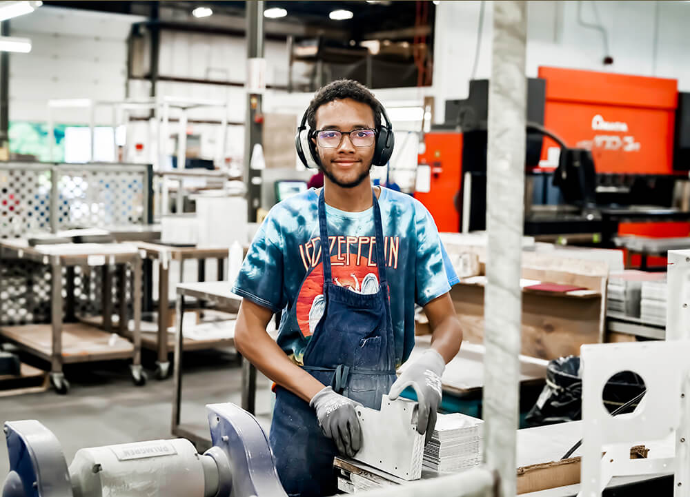 metal-grinding-metal-sanding-technician-smiling-gtr-manufacturing